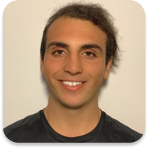 Young Adult male smiling in front of a white background